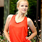 Pic of Good-looking blonde gal poses in a red dress near a pool flaunting her sweet round butt. - TheMetArt.com