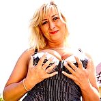 Pic of Blonde matrue slut masturbating outside