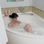 Pic of Mature chick joins a sexy girl in bubble bath getting to wet lesbian games