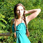Pic of Amazing chick with two long pigtails taking off clothes and spreading legs on the riverside.