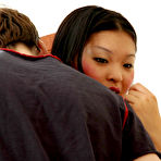 Pic of Nasty Asian babe greeting her lewd boyfriend with ready to action strap-on