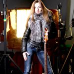 Pic of Slim and sexy rock chick Alyssa A strips to show her shaved beaver while wielding a guitar.  