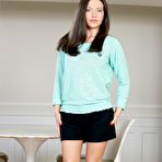 Pic of Dark haired gadget Subil Arch is slowly taking off her top and skirt for viewers