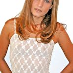 Pic of Slim lady sexy posing on camera showing her small titties off and displaying her shaved cunt.