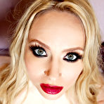 Pic of Bosomy blonde milf Aiden Starr taking off her pink lingerie and spreading the slits