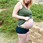 Pic of PreggoTegan.com-Tegan wearing military and using dildo