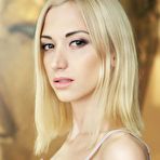 Pic of Shaved blonde beauty Anna Lee teases with her skinny ass and tight pussy on a big bed.