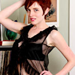 Pic of 
      Busty redhead RyAnne in black lingerie at All Natural Cuties
 