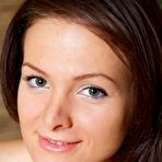 Pic of Shaved brunette Zhanet A exposes her long legs, tasty ass and shaved pussy in bed.