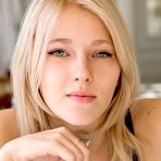 Pic of Mesmerizing blonde Mila I rolls around in her bed showing off her shaved pussy in a long dress.