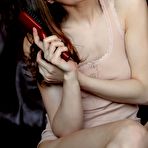 Pic of Charming teen Loretta A shows her shaved pussy and touches herself naughtily.