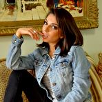 Pic of Curvy brunette Darcie Dolce strip teasing indoors at PinkWorld Blog