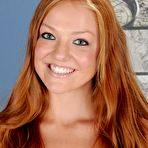 Pic of Redhead gadget Farrah Flower is spreading her delicious tan lined body before cam