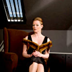 Pic of English redhead Holly Kiss boasts her vintage underwear and opens legs in fully-fashioned nylons