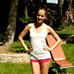 Pic of Skinny Lola Myluv watches an outdoor striptease with Silvie Luca and clamps her shaved pussy.
