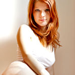 Pic of Smoldering hot redhead babe Mia Sollis shows off her shaved soft pussy for camera