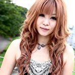 Pic of Asian girl Sarina Tsubaki sits on hunkers and bares off tits and the bottom