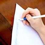 Pic of Cute brunette Izabel A gets chosen from many babe to strip and pose on a fancy table.