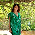 Pic of Angelic Divina A poses on a secluded beach and shows her slim body and shaved pussy.