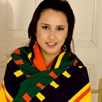 Pic of Naked European brunette girl Edita Bente parts her legs and opens her shaved pussy