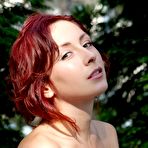 Pic of Sexy redhead babe Night A lifts her skirt up and shows us her fine tight pussy