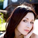 Pic of The beautiful brunette chick Night A and her enticing softcore posing on the beach