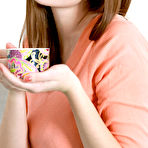 Pic of Marta E enjoys a cup of coffee before she start stripping on the sofa