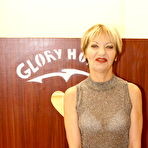 Pic of Horny mature slut sucking cock through a hole