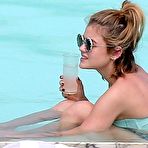 Pic of Lucy Hale in a bikini at her hotel pool