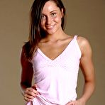 Pic of Lovely young brunette Irina Bruni bends over for the camera to make juicy softcore porn