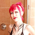 Pic of Short haired inked up alt redhead Jax shows off her tattoos in the shower