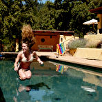 Pic of Lesbian domina Audrey Leigh humiliates naked sexy girl Jade Marxxx at the poolside in the sun