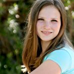 Pic of Youthful smoothie Jules Nubiles with cute smile feels no shame while getting nude in the backyard