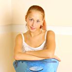 Pic of Stripping her white top and jeans skirt Dasha Nubiles poses on the chair