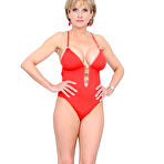 Pic of Busty mom Lady Sonia removes her tight red teddy and gives a close-up of her shaved twat