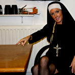 Pic of Shaved pussy nun Krystal Niles takes off her uniform and lingerie after cock domination