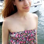 Pic of Tiny teen Latina Mae Olsen worlks her oral sex skills on a monster dong