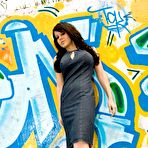 Pic of Bryci in mini dress and high heels exposes her big melons and sexy ass outdoors