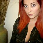 Pic of The redhead teen Lucy Vixen is taking off cloths and recording her own big melons
