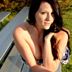 Pic of Outdoor loving brunette Freckles hikes up her little dress to present a sweet ass in panties.