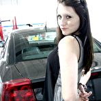 Pic of Naughty brunette Freckles strips down to her red lingerie and sprawls all over that muscle car