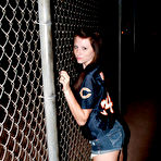 Pic of Naughty brunette chick Freckles with perky tits makes a strip show outdoors