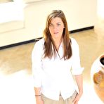 Pic of Hayley Hanes in high heels and short skirt takes off her panties on the stairs