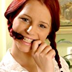 Pic of The slutty redhead chick Piper Fawn stripping and masturbating shaved pussy at the working place