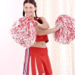 Pic of Pigtailed cheerleader Jessica Fiorentino has fun and stuffs her slit by orange dildo.