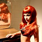 Pic of Gorgeous redhead Kirsten Price poses in black lingerie and nylon stockings then bares her tits