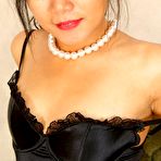 Pic of Petite brunette milf in black stockings