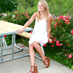 Pic of Meet Madden in her summer white dress outdoors