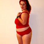 Pic of Fat redhead Tanya Tung takes black schlong after stripping out of her red lingerie