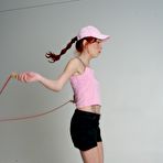 Pic of Sexy legged redhead Eletra Angels does exercises in uniform before riding cock in the nude